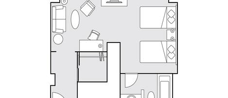 A floor plan of a hotel room with a bed, a desk, a chair, a small table, a sofa, and a bathroom.