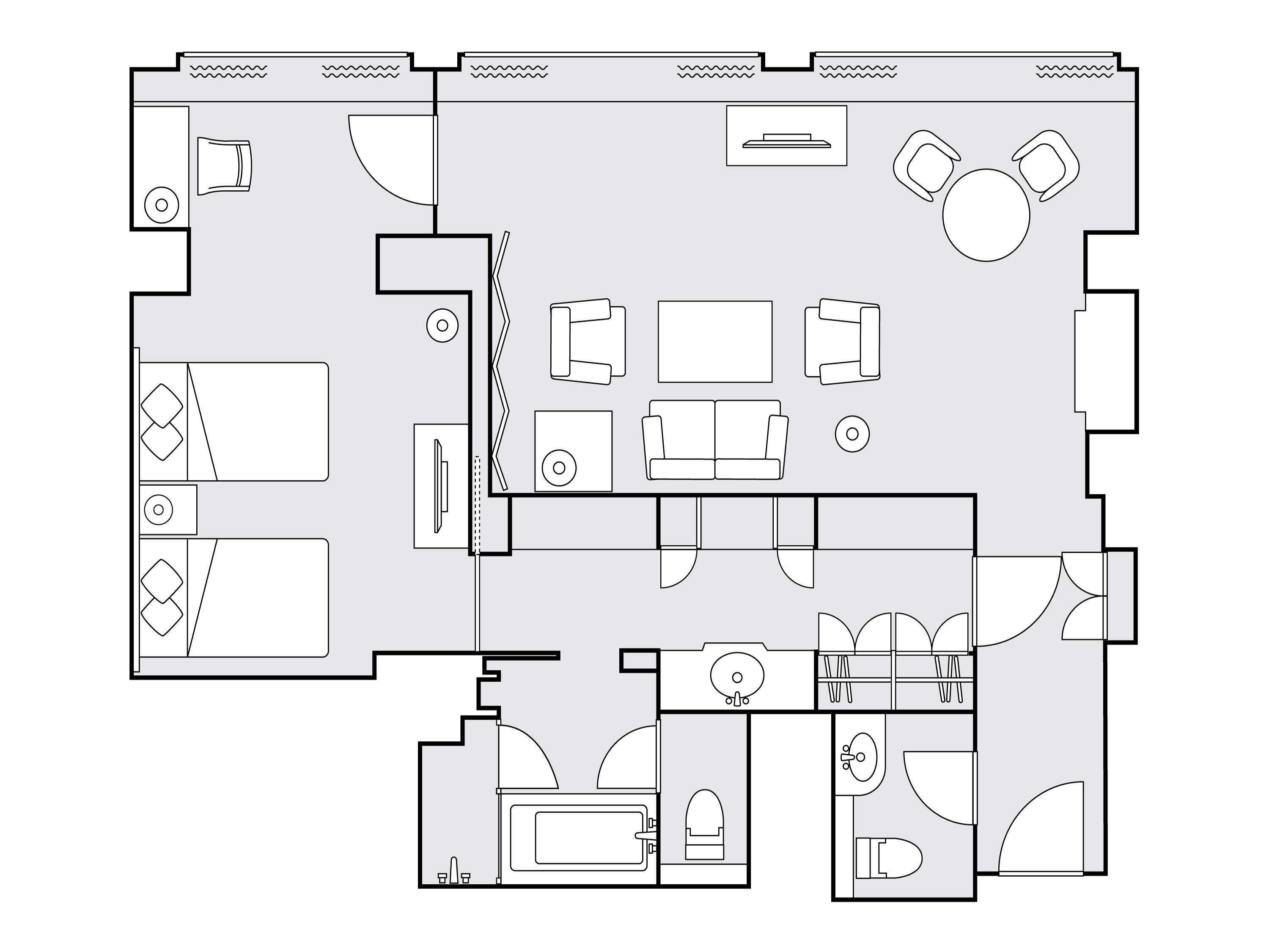Plano de un hotel que muestra un vestíbulo central, varias habitaciones, un baño y un comedor.