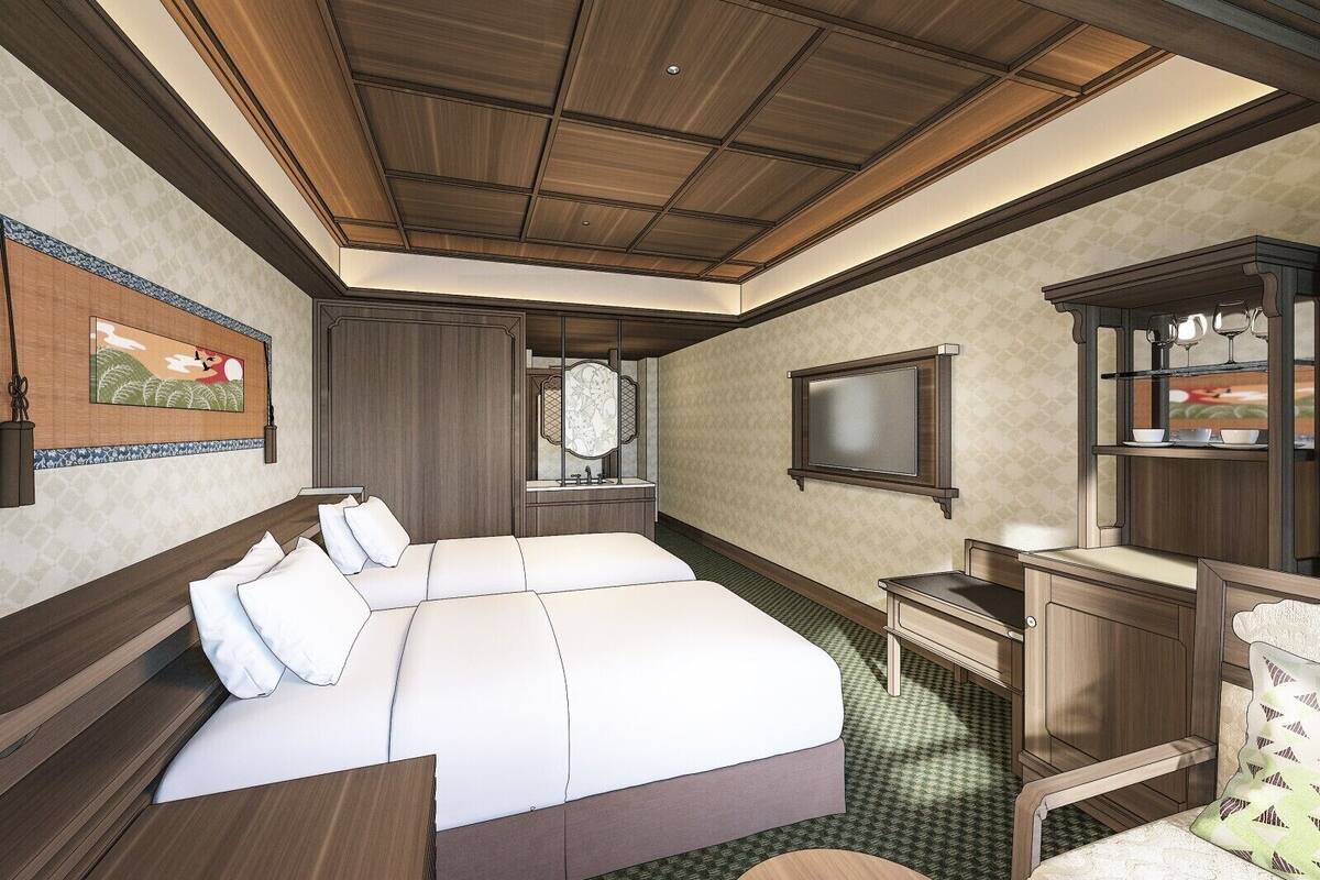 A bedroom with a large bed, a desk, a mirror, and a cabinet.