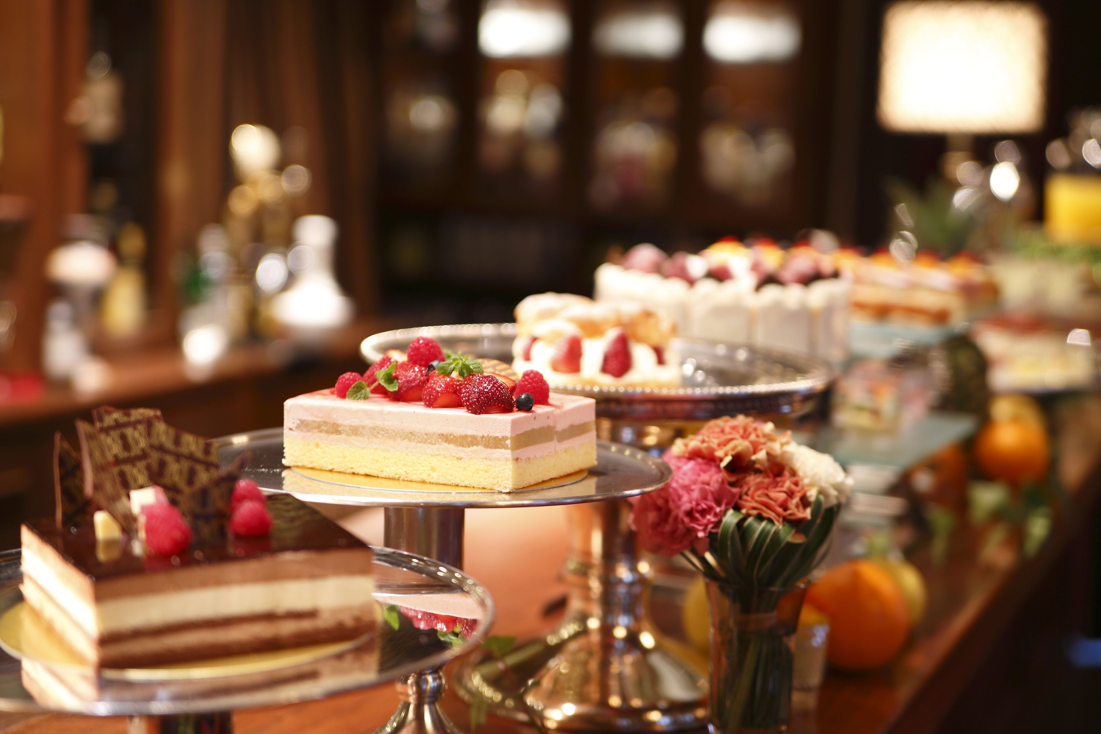 A variety of desserts on display at a buffet.