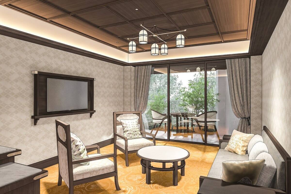 A modern living room with a TV, seating, and a large window.