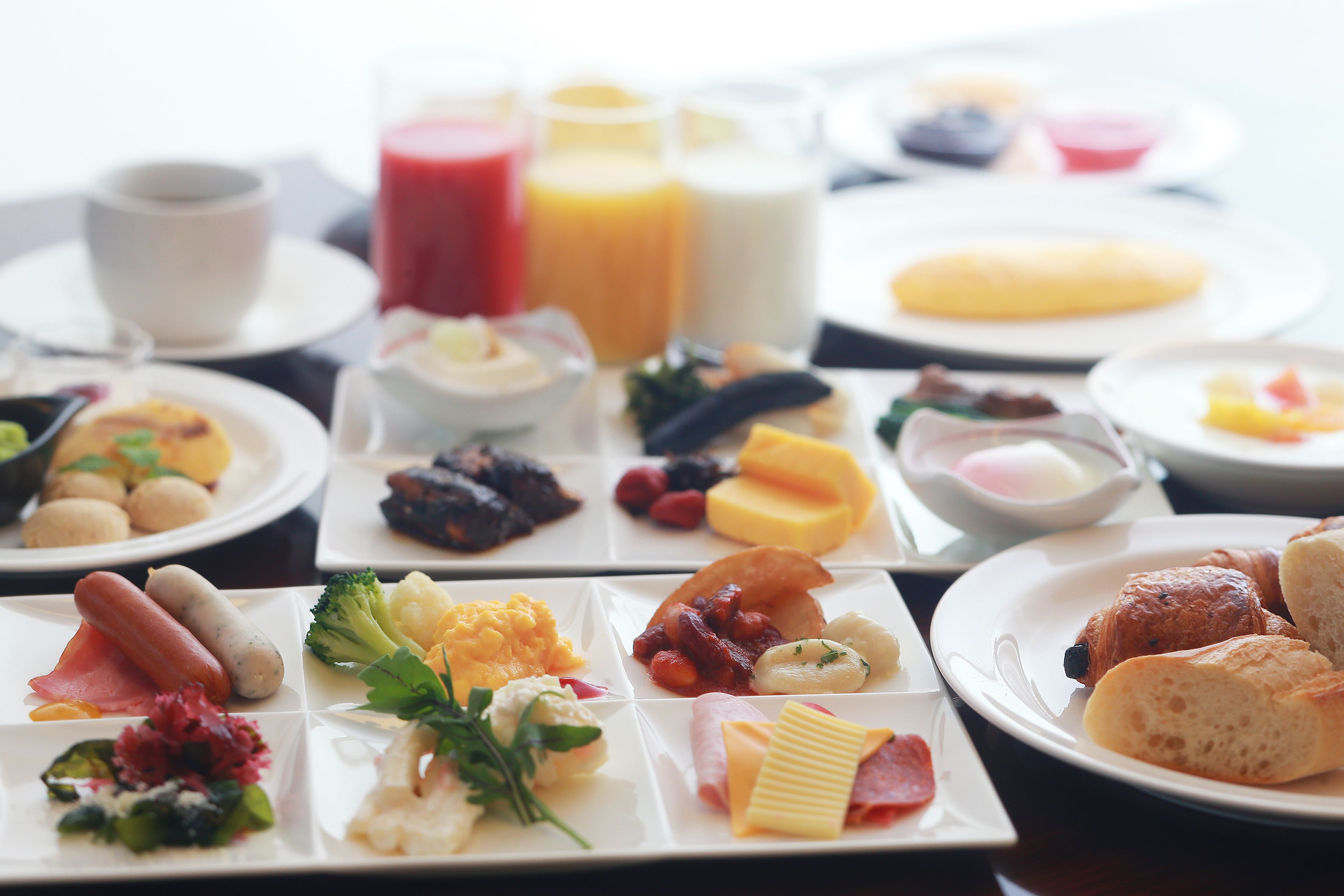 A breakfast buffet with various food items and beverages.