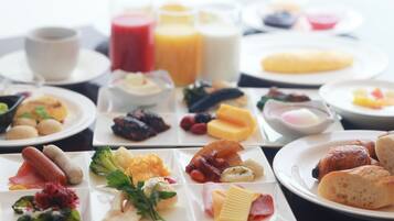 A breakfast buffet with various food items and beverages.