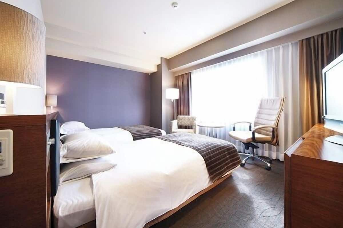 Premium bedding, down duvets, in-room safe, desk