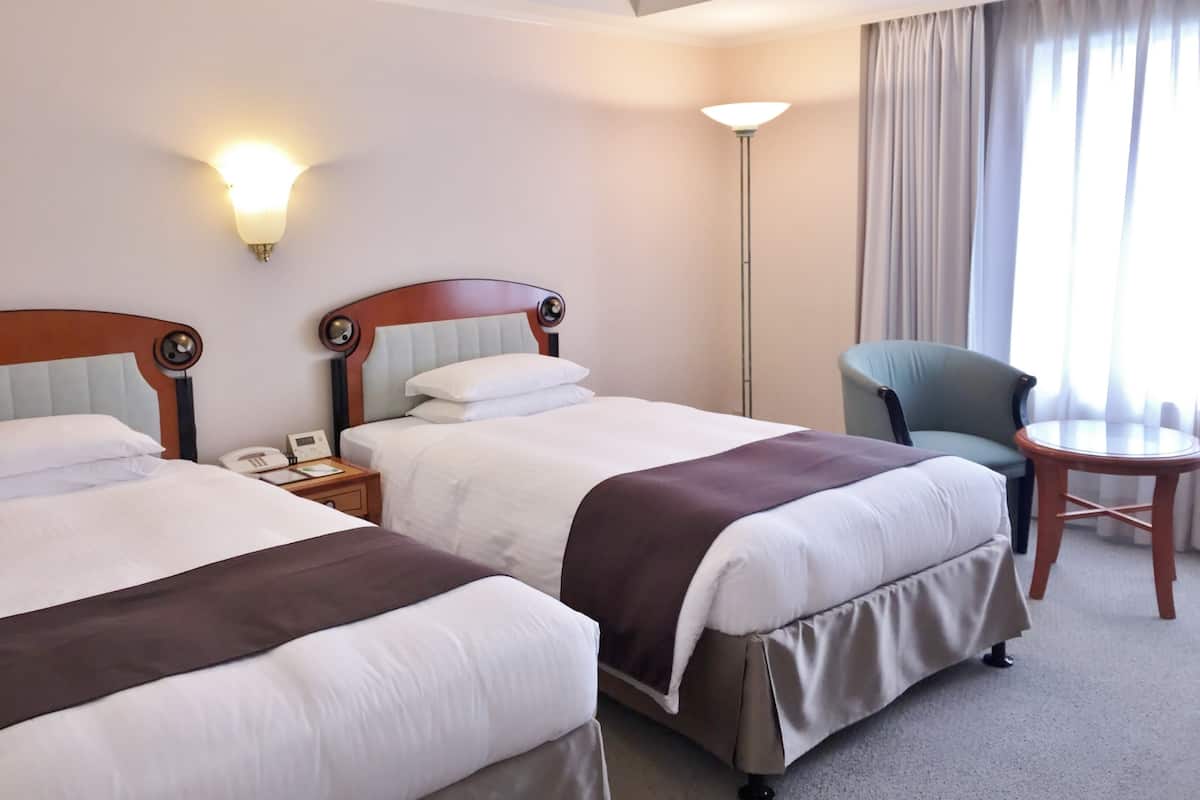 Down comforters, desk, blackout drapes, iron/ironing board