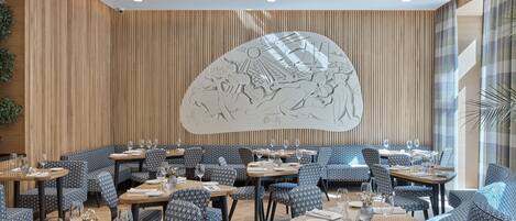 A restaurant with patterned blue and white seating, wooden panel walls, and a large wall mural.