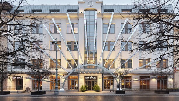 A modern hotel with a prominent entrance, large windows, and a symmetrical facade. - Neringa Hotel (Vilnius)