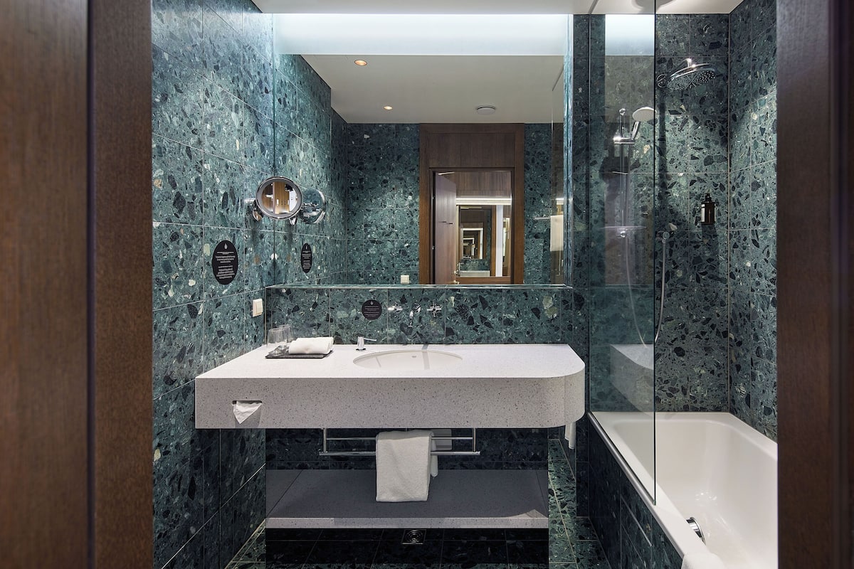 hair dryer, slippers, towels, soap