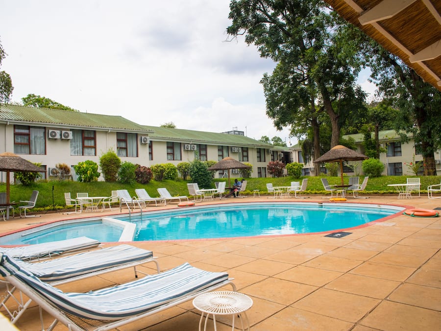 Outdoor pool, open 8:00 AM to 5:00 PM, pool umbrellas