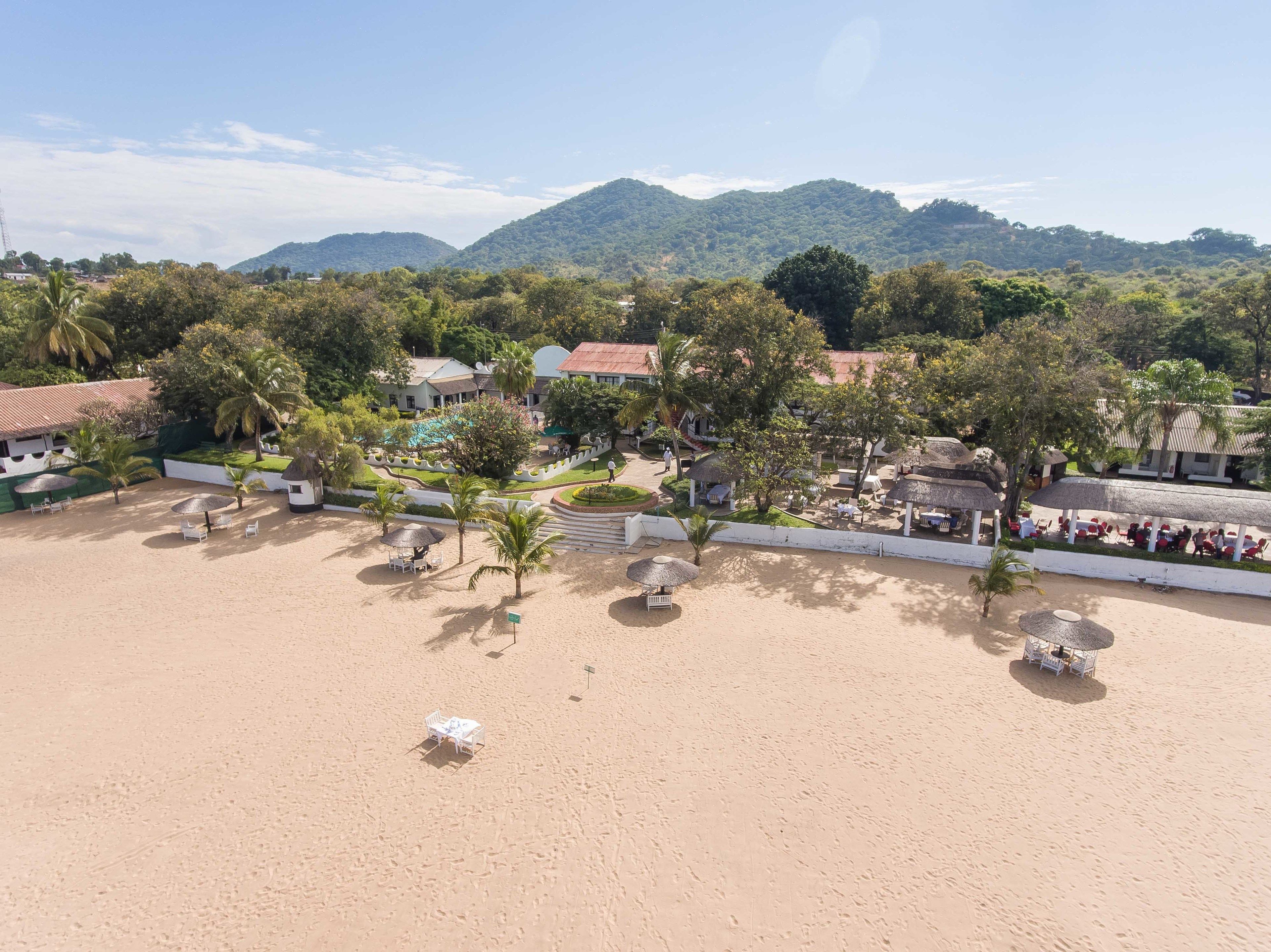 On the beach, beach umbrellas, windsurfing, sailing