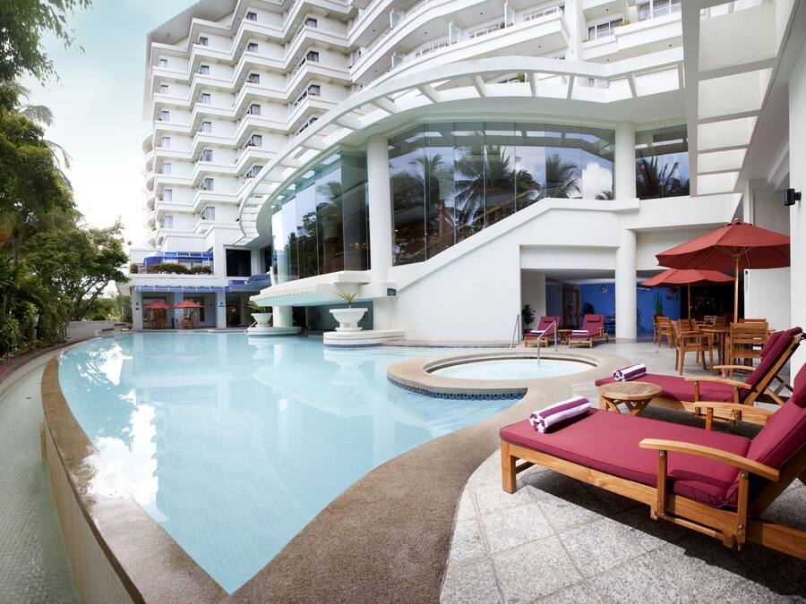 Outdoor pool, open 7:00 AM to 7:00 PM, pool umbrellas, sun loungers