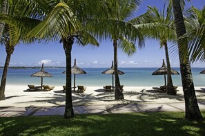 On the beach, white sand, free beach cabanas, sun-loungers