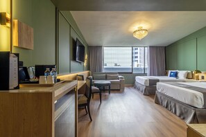 Habitación Deluxe | Ropa de cama de alta calidad y colchones con acolchado adicional