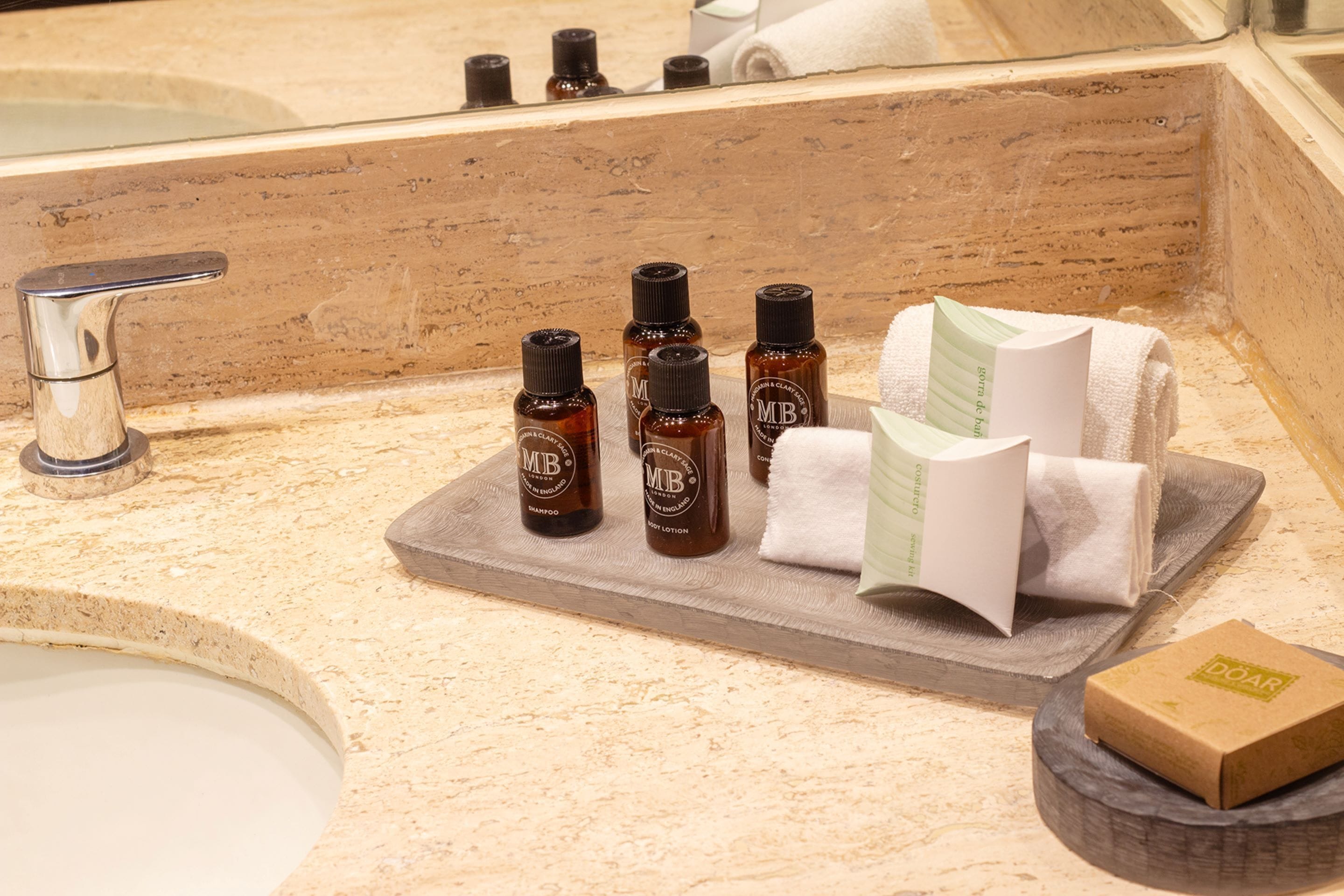 eco-friendly toiletries, hair dryer, towels, soap