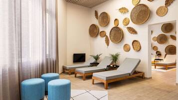 Relax in a serene space with a seating area, woven baskets, and a large window.