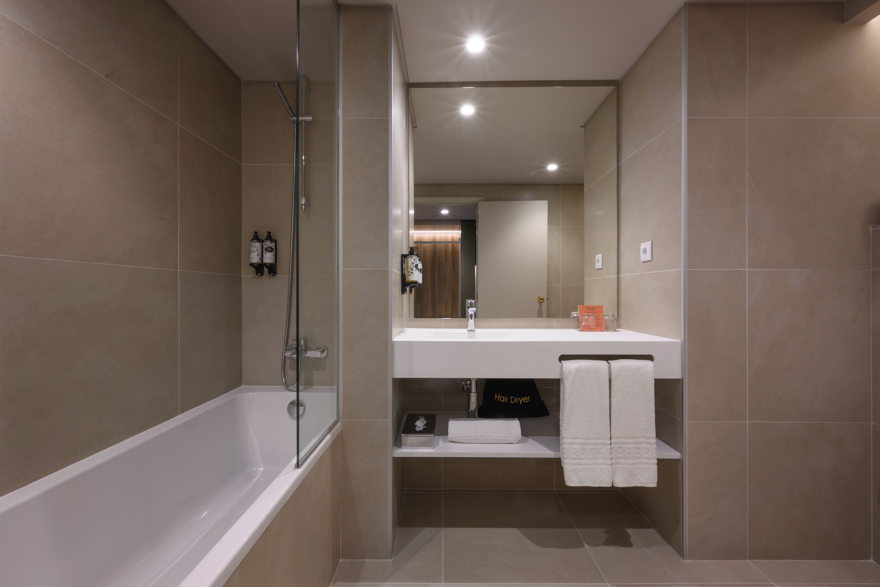 junior suite | bathroom | hair dryer, bidet, towels