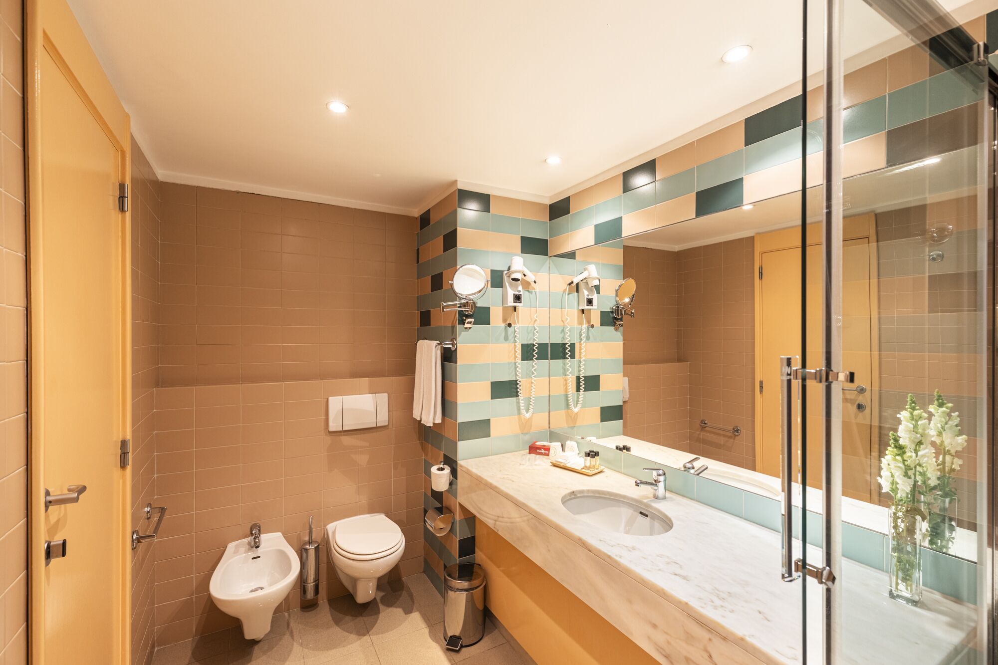 bathtub, hair dryer, bidet, towels