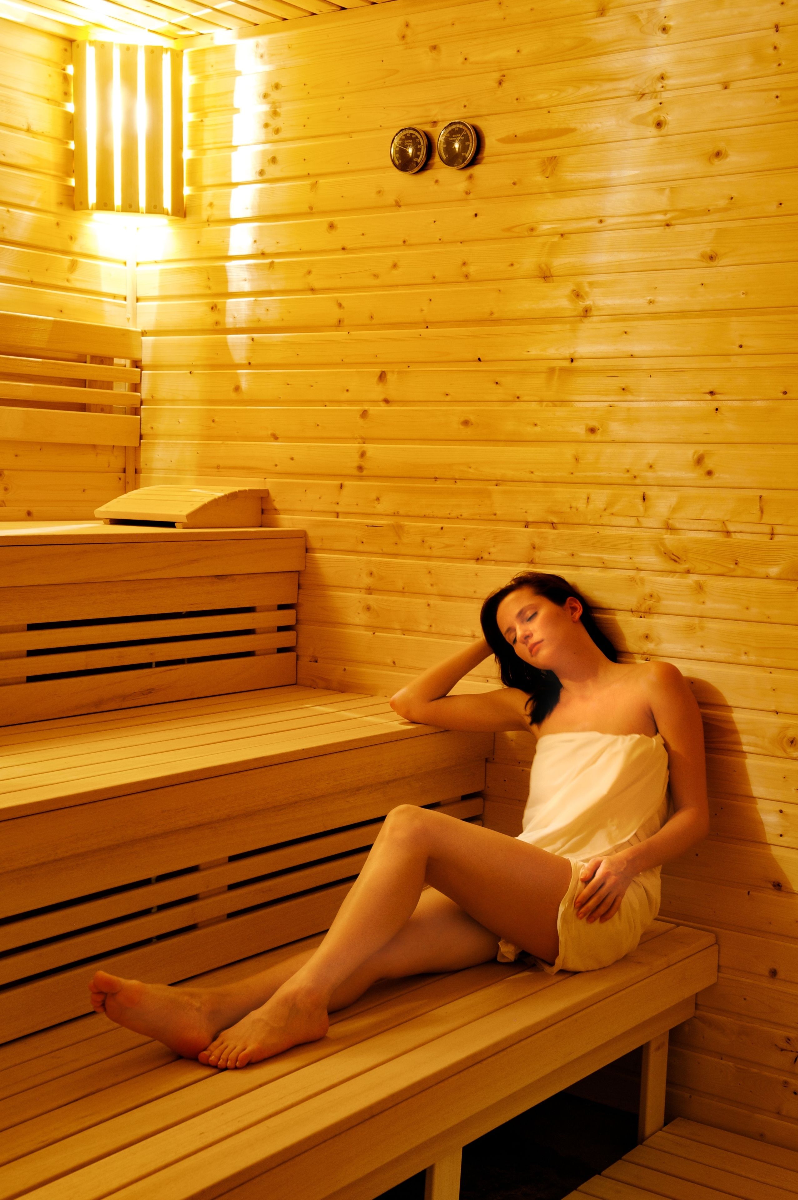 A sauna with wooden benches and a bench seat.