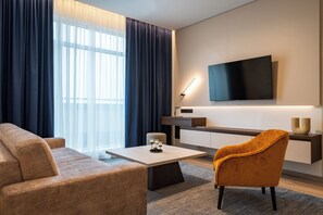 Deluxe Apartment | Living area | Smart TV