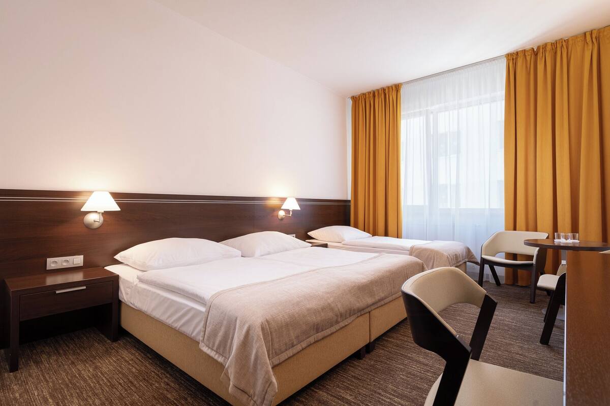Executive Triple Room | Hypo-allergenic bedding, minibar, in-room safe, blackout curtains
