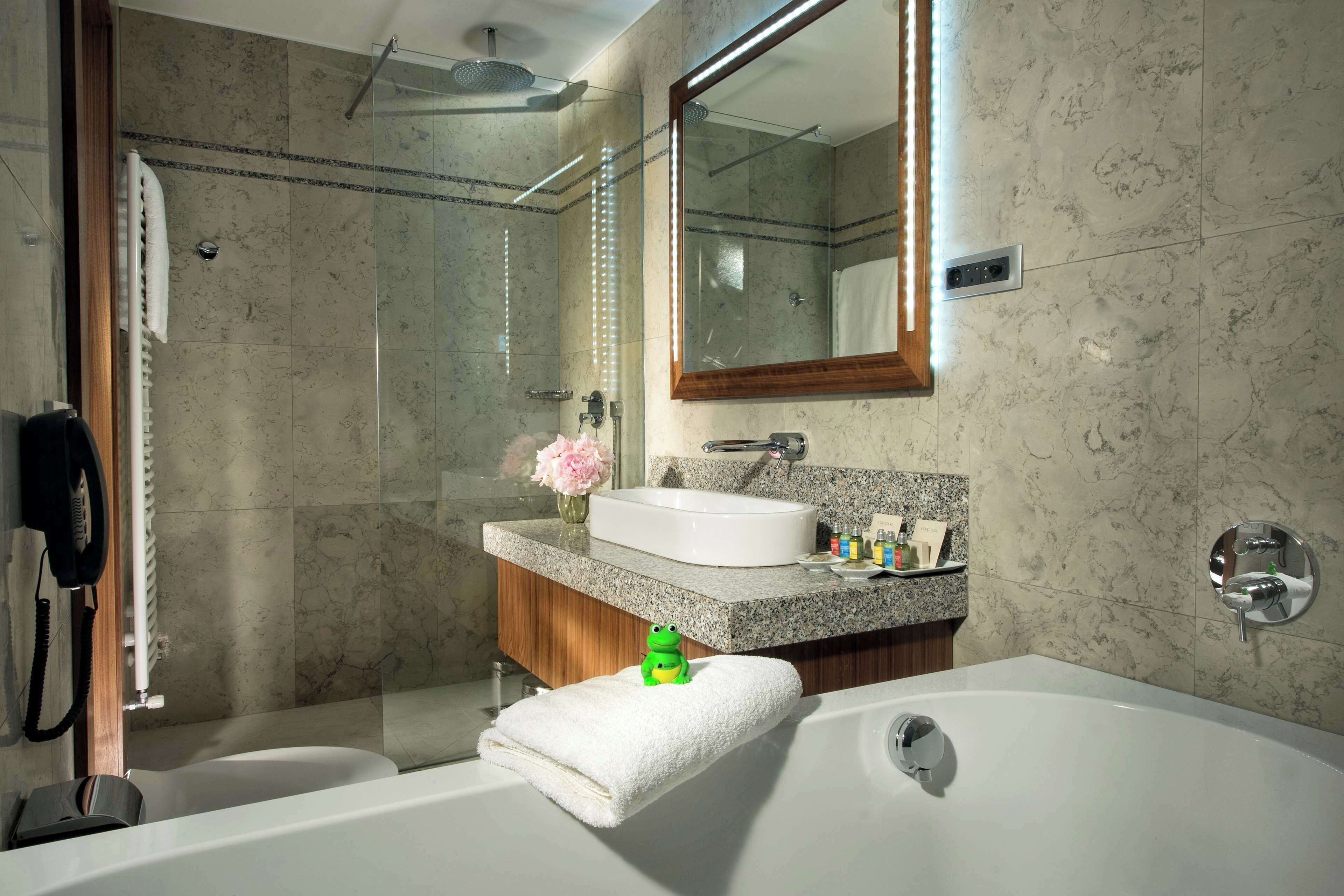 deluxe room, 1 king bed (walk-in shower;superior;with sofabed) | bathroom | combined shower/bathtub, rainfall showerhead, designer toiletries