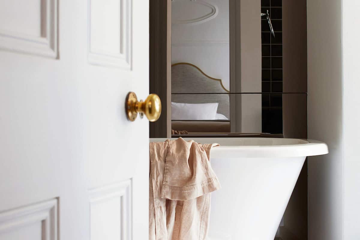 designer toiletries, hair dryer, bathrobes, slippers