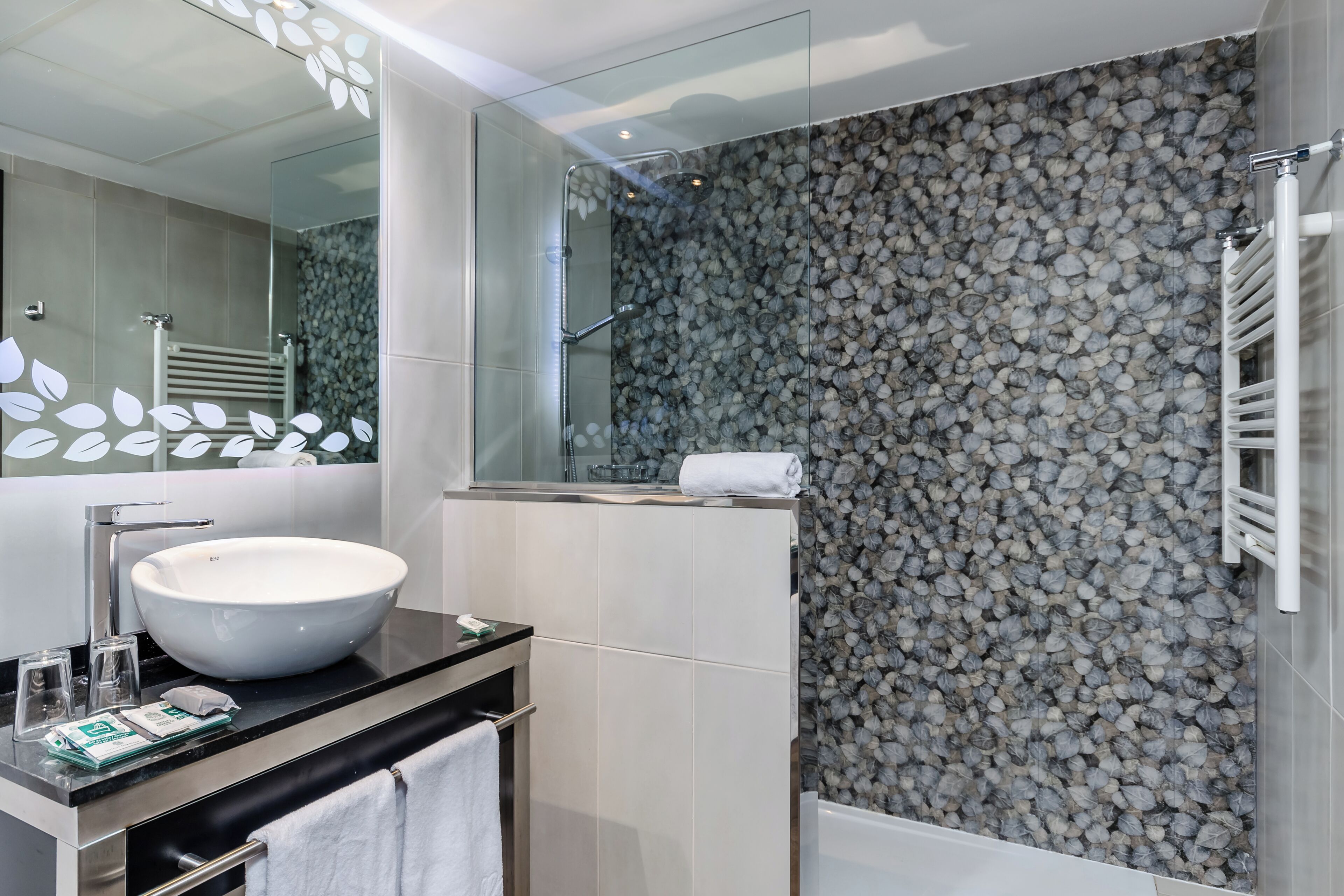 rainfall showerhead, eco-friendly toiletries, hair dryer, towels