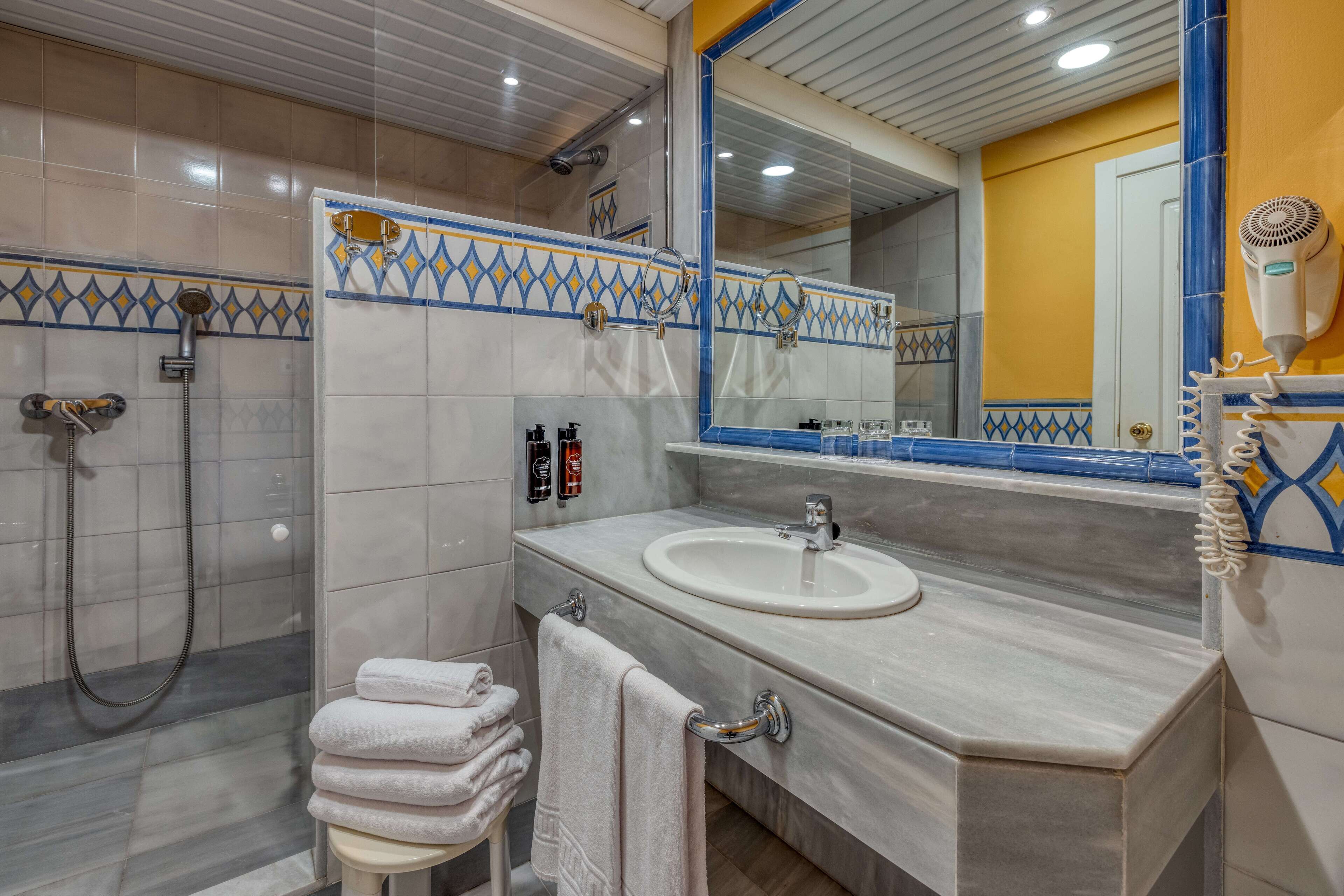 rainfall showerhead, eco-friendly toiletries, hair dryer, bidet