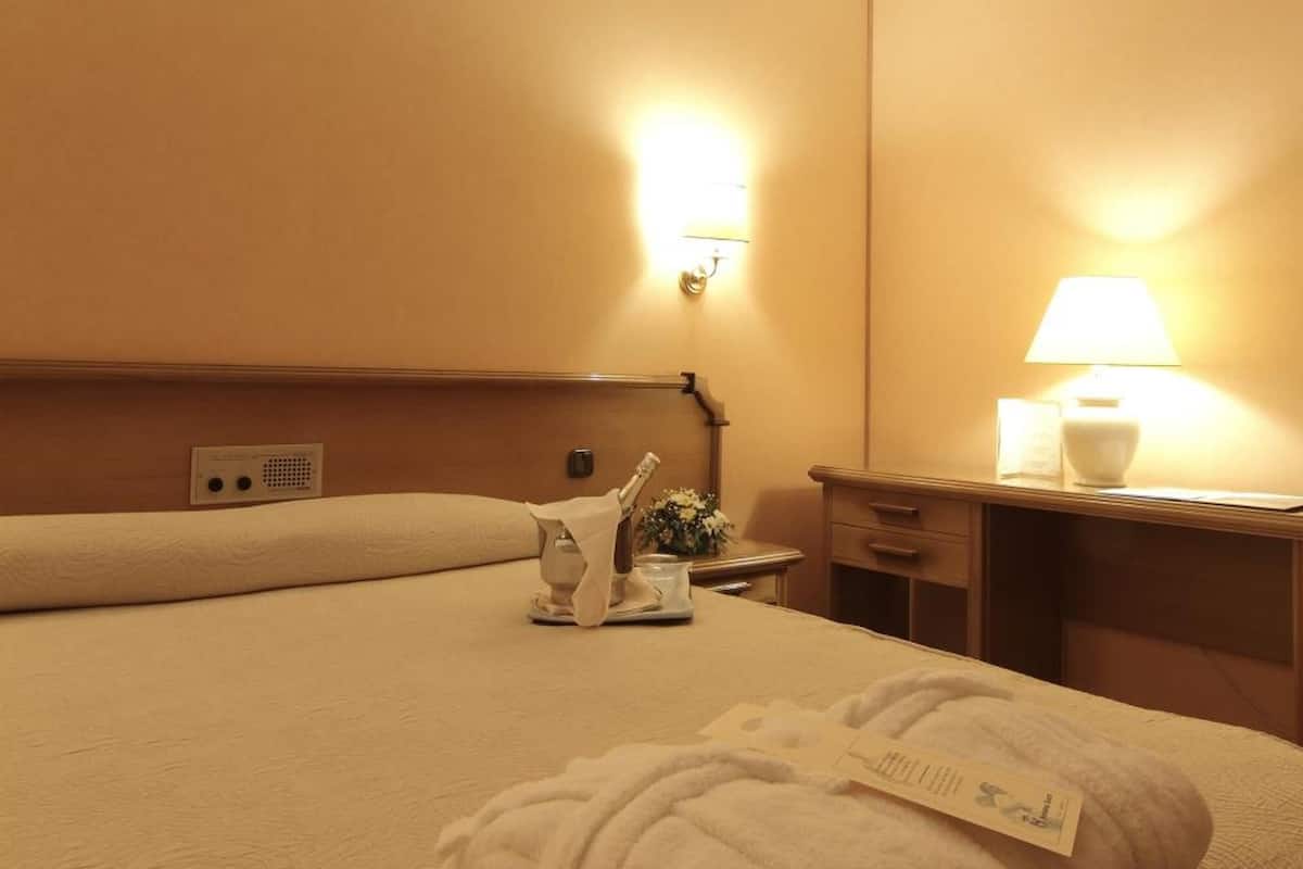 minibar, desk, blackout curtains, iron/ironing board