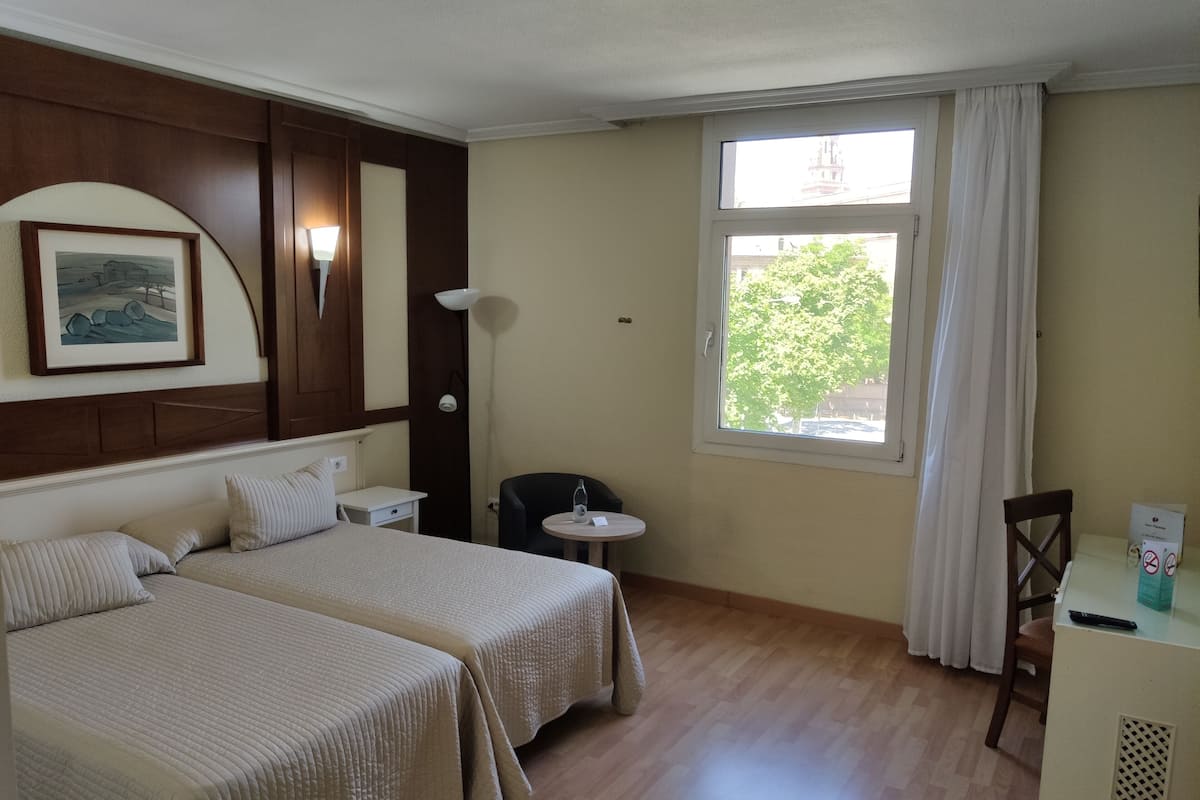 Double or Twin Room | Minibar, in-room safe, desk, blackout drapes
