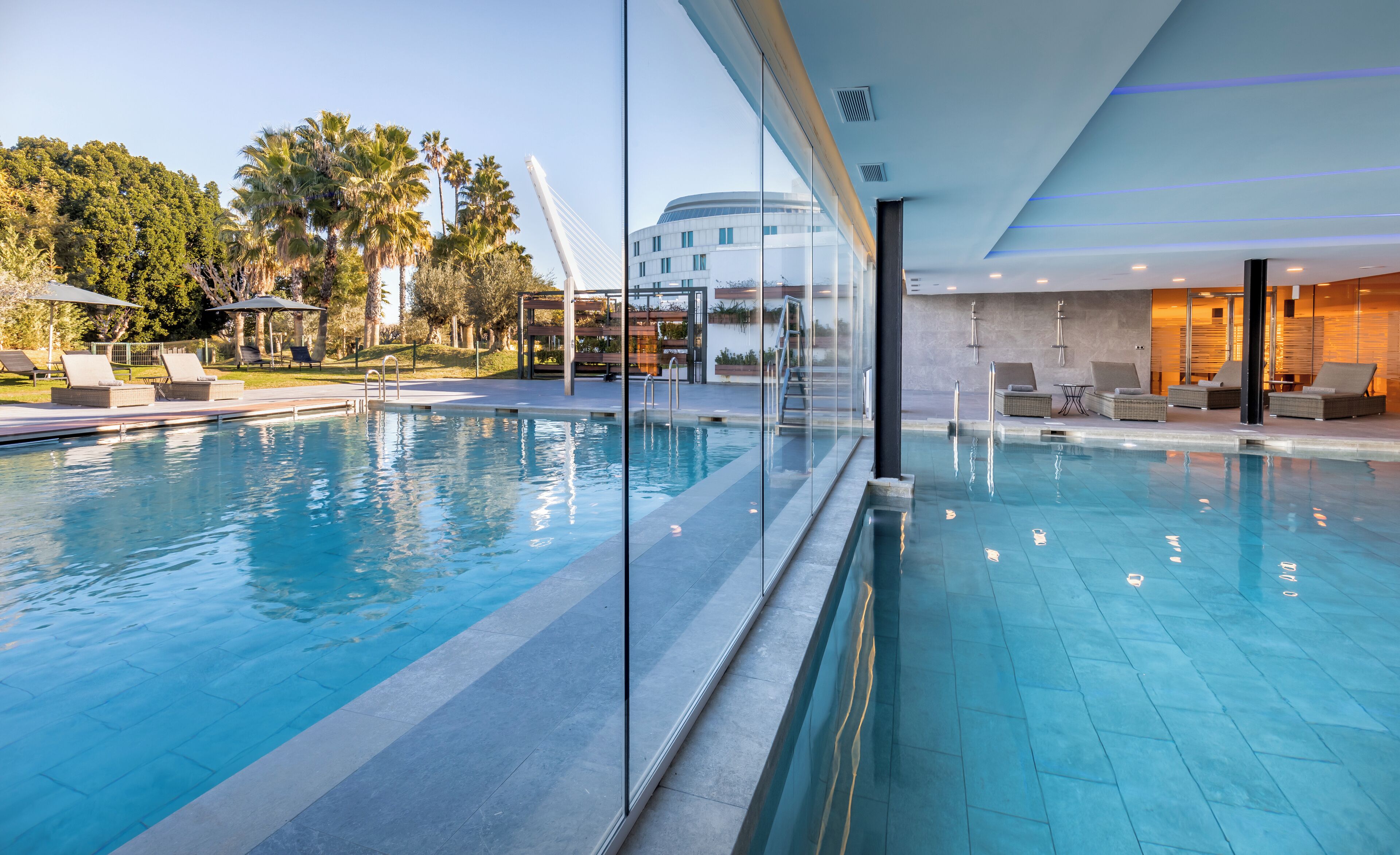 Indoor pool, seasonal outdoor pool, pool umbrellas, pool loungers