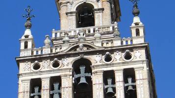A historic tower with intricate architectural details, including multiple bell towers and ornate decorations.