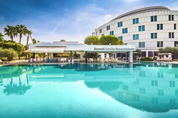 Indoor pool, seasonal outdoor pool, pool umbrellas, pool loungers