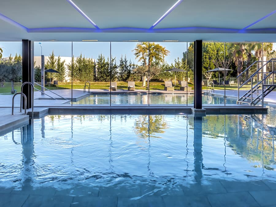 Indoor pool, seasonal outdoor pool, pool umbrellas, pool loungers