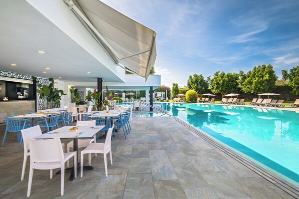 Indoor pool, seasonal outdoor pool, pool umbrellas, pool loungers