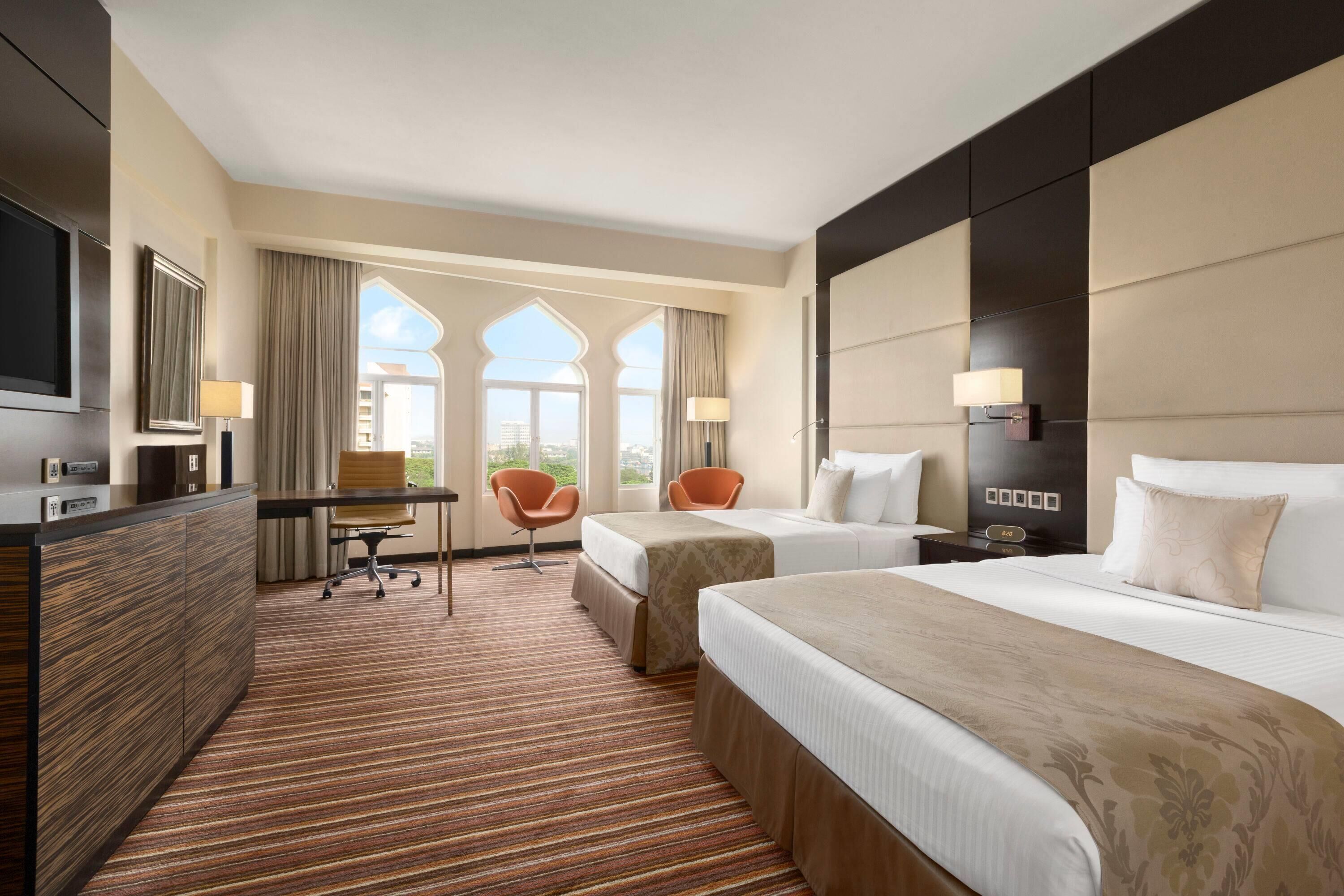 Premium bedding, down comforters, pillowtop beds, minibar