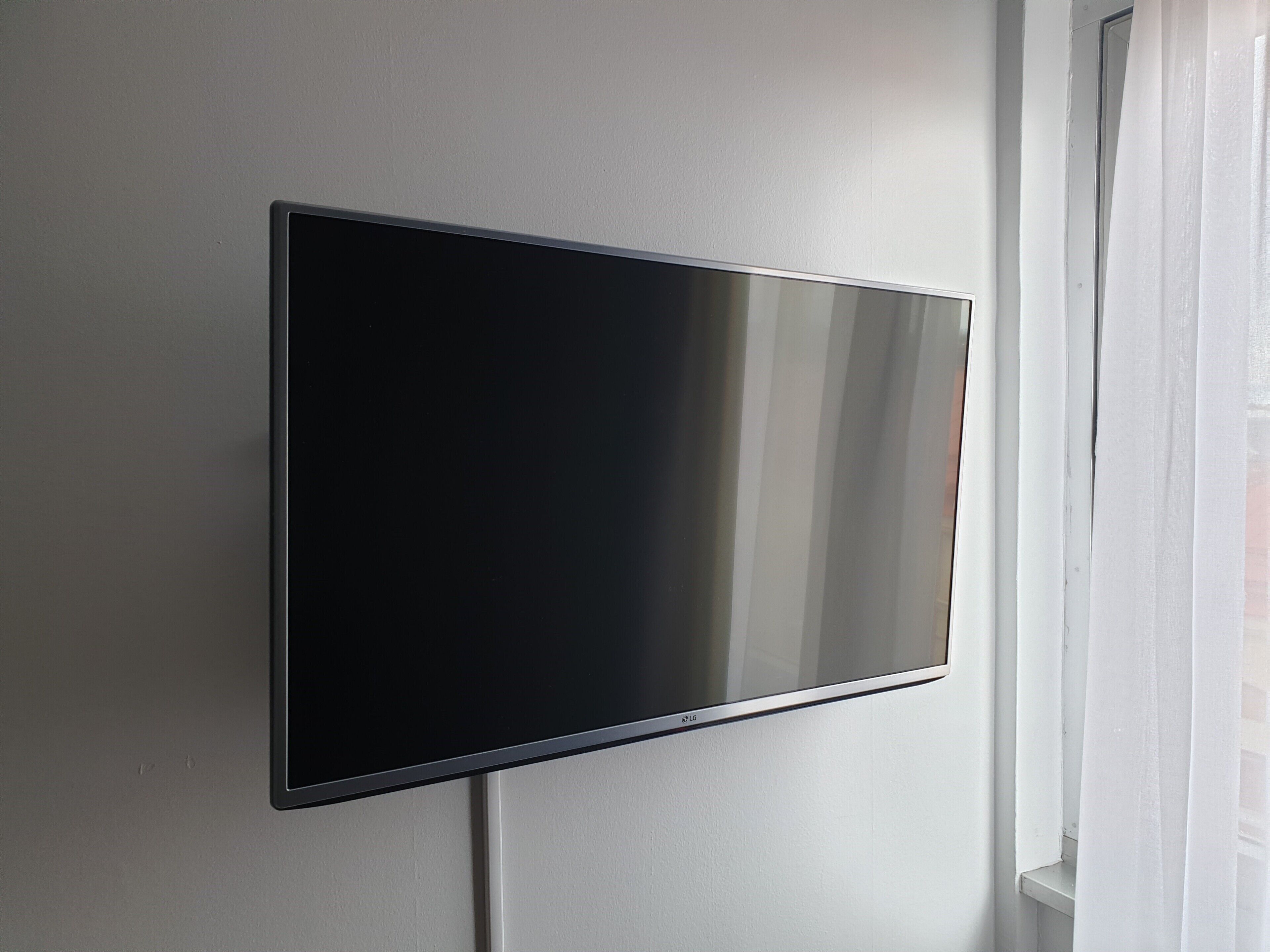 A flat-screen TV mounted on a wall.