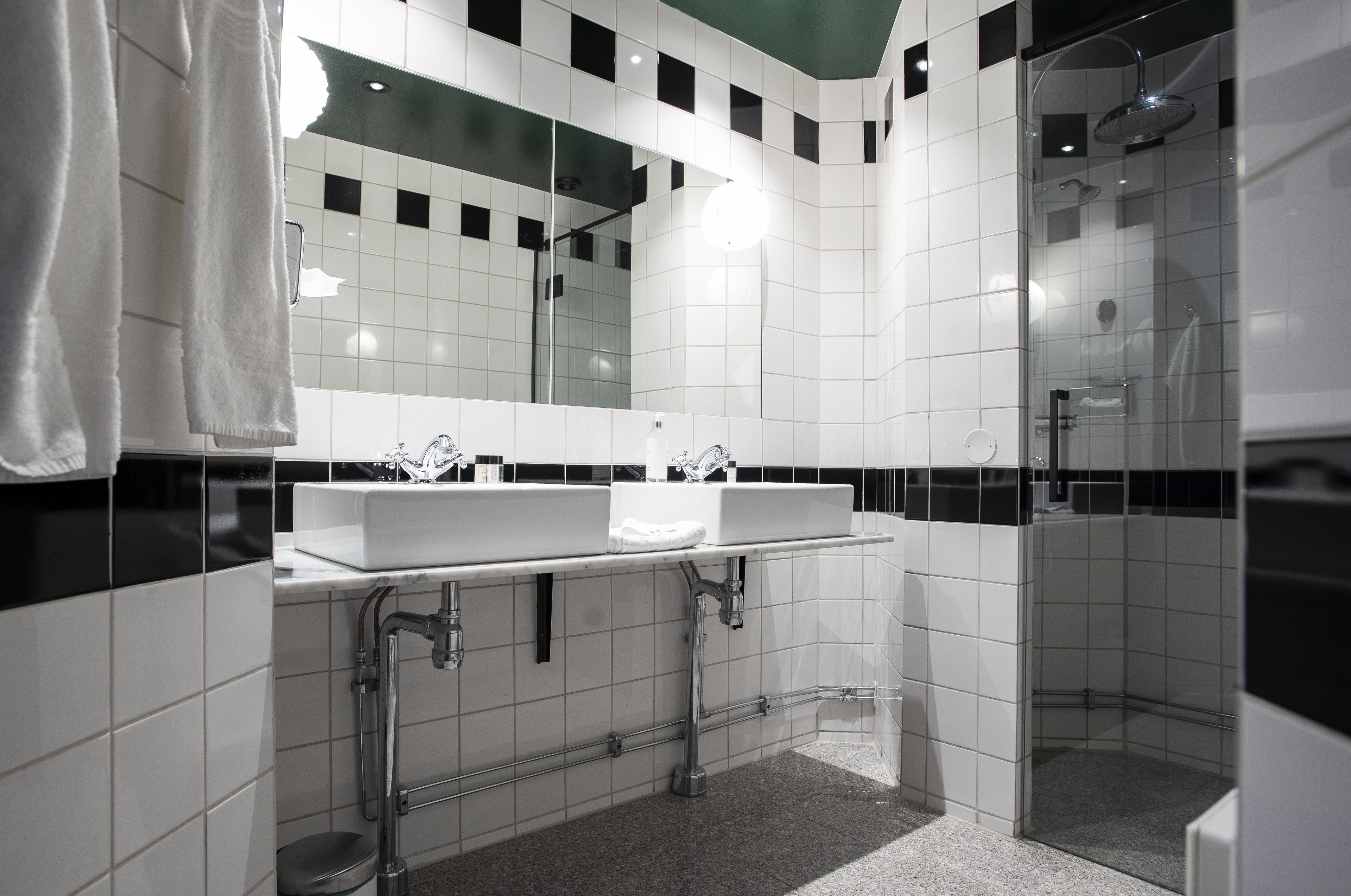 junior suite | bathroom | shower, designer toiletries, hair dryer, towels