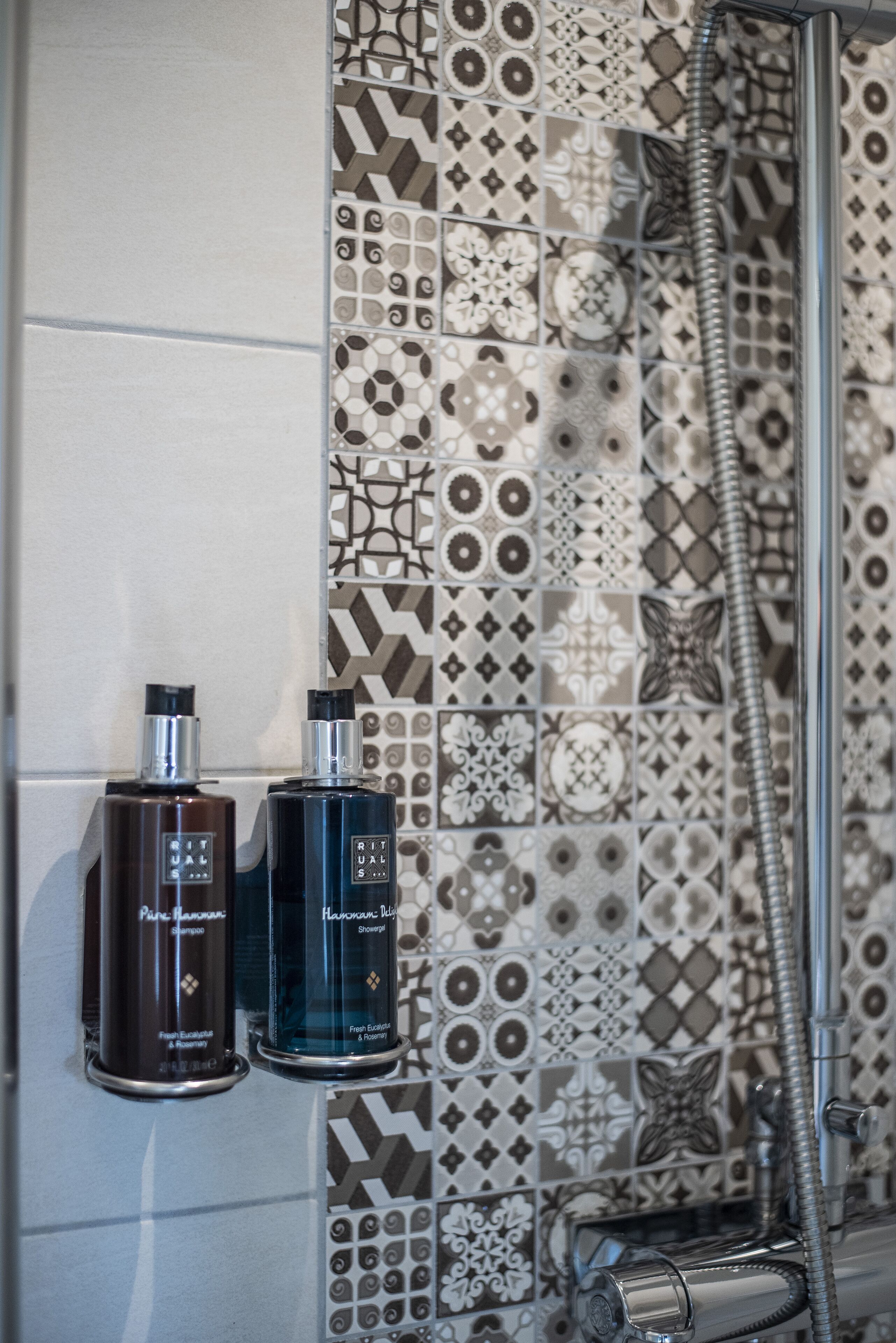 shower, designer toiletries, hair dryer, towels