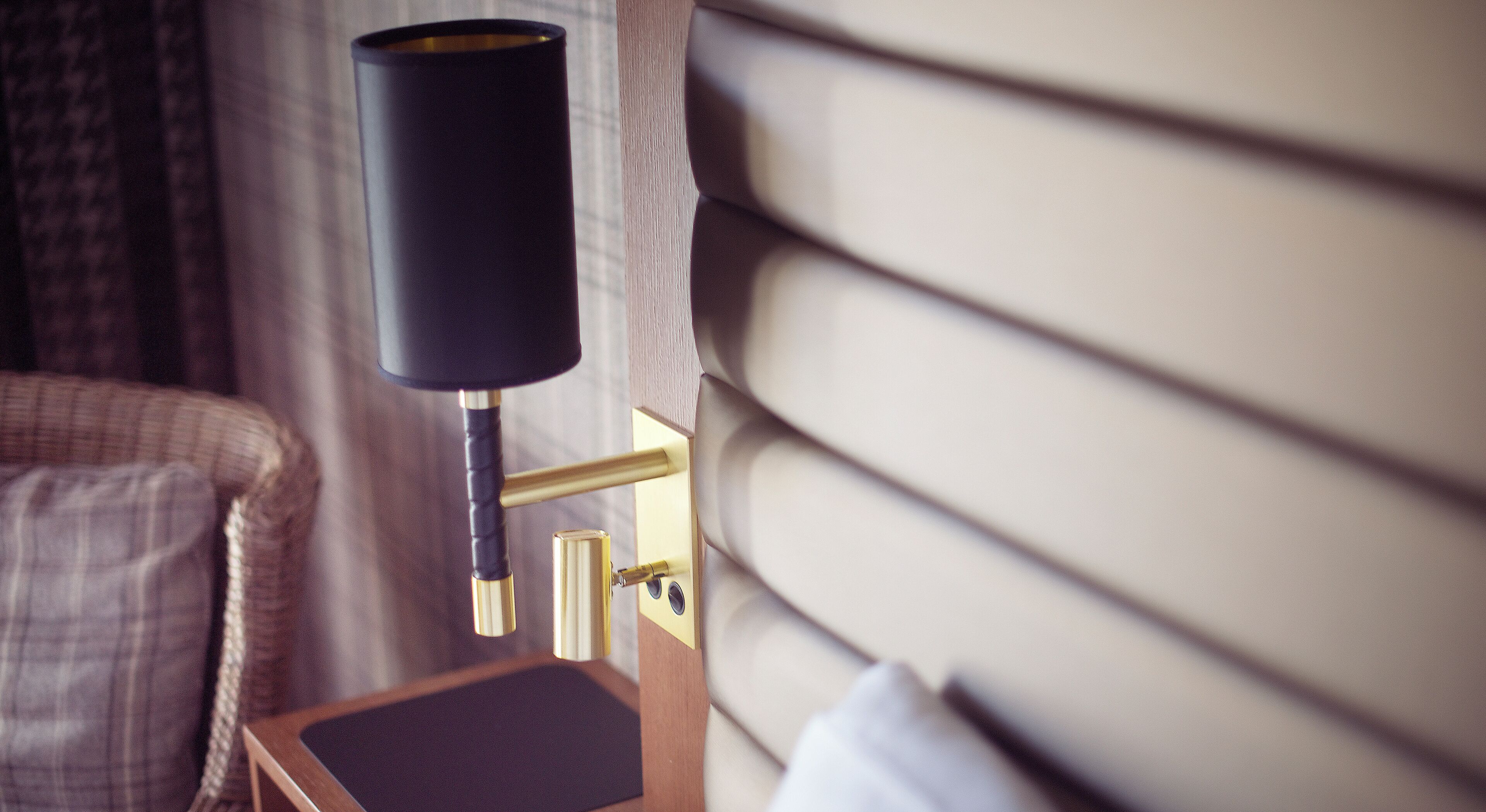 desk, laptop workspace, iron/ironing board, bed sheets