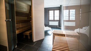 A modern bathroom with a wooden bench, a small stool, and a wooden sauna bench. - Scandic Kista (Kista)