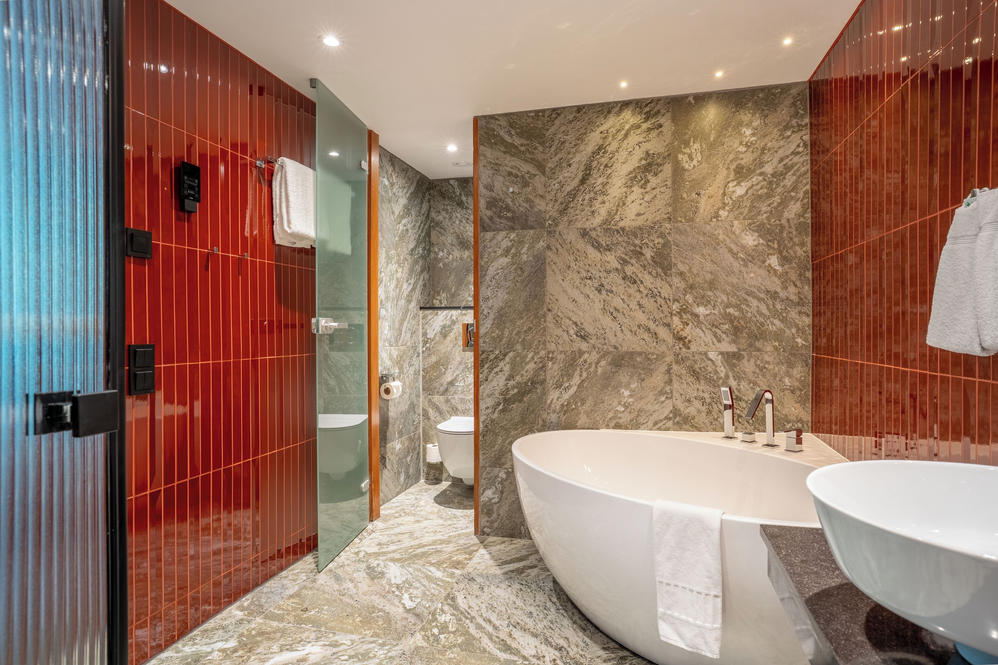 superior suite, 1 king bed | bathroom | rainfall showerhead, eco-friendly toiletries, hair dryer, towels