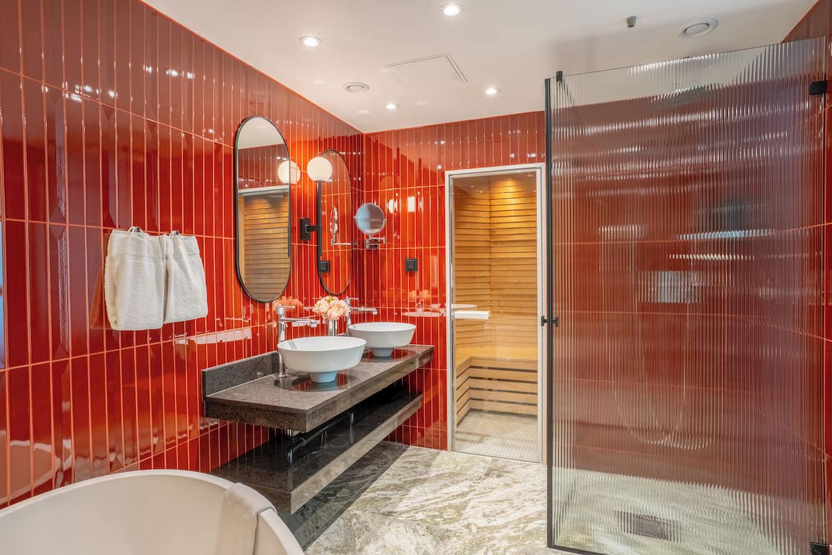 rainfall showerhead, eco-friendly toiletries, hair dryer, towels