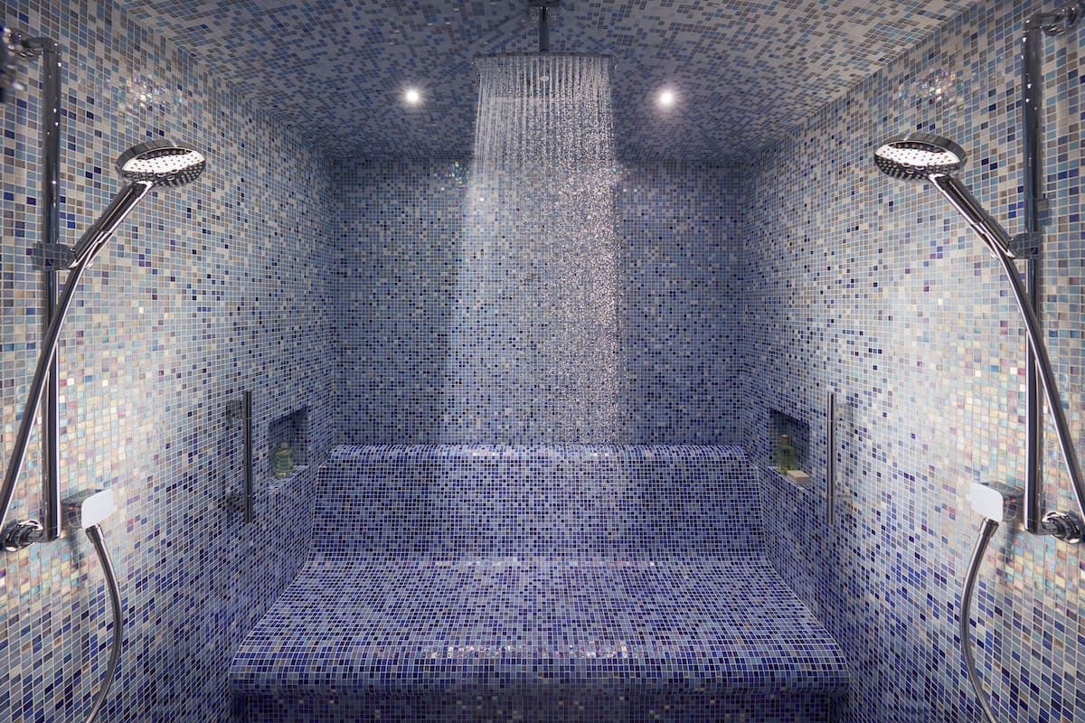 separate bathtub and shower, rainfall showerhead, designer toiletries