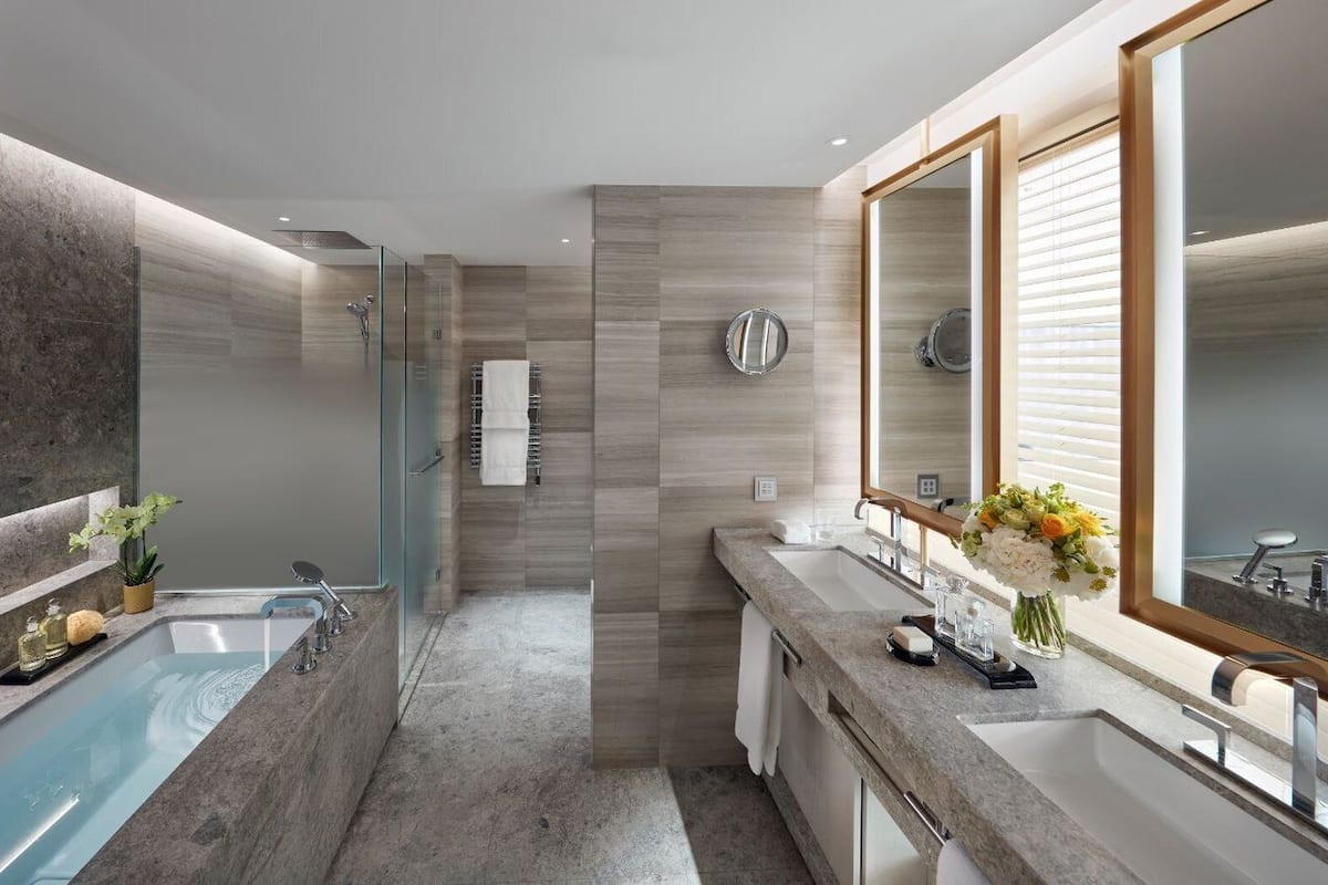 junior suite (rooftop) | bathroom | separate bathtub and shower, rainfall showerhead, designer toiletries