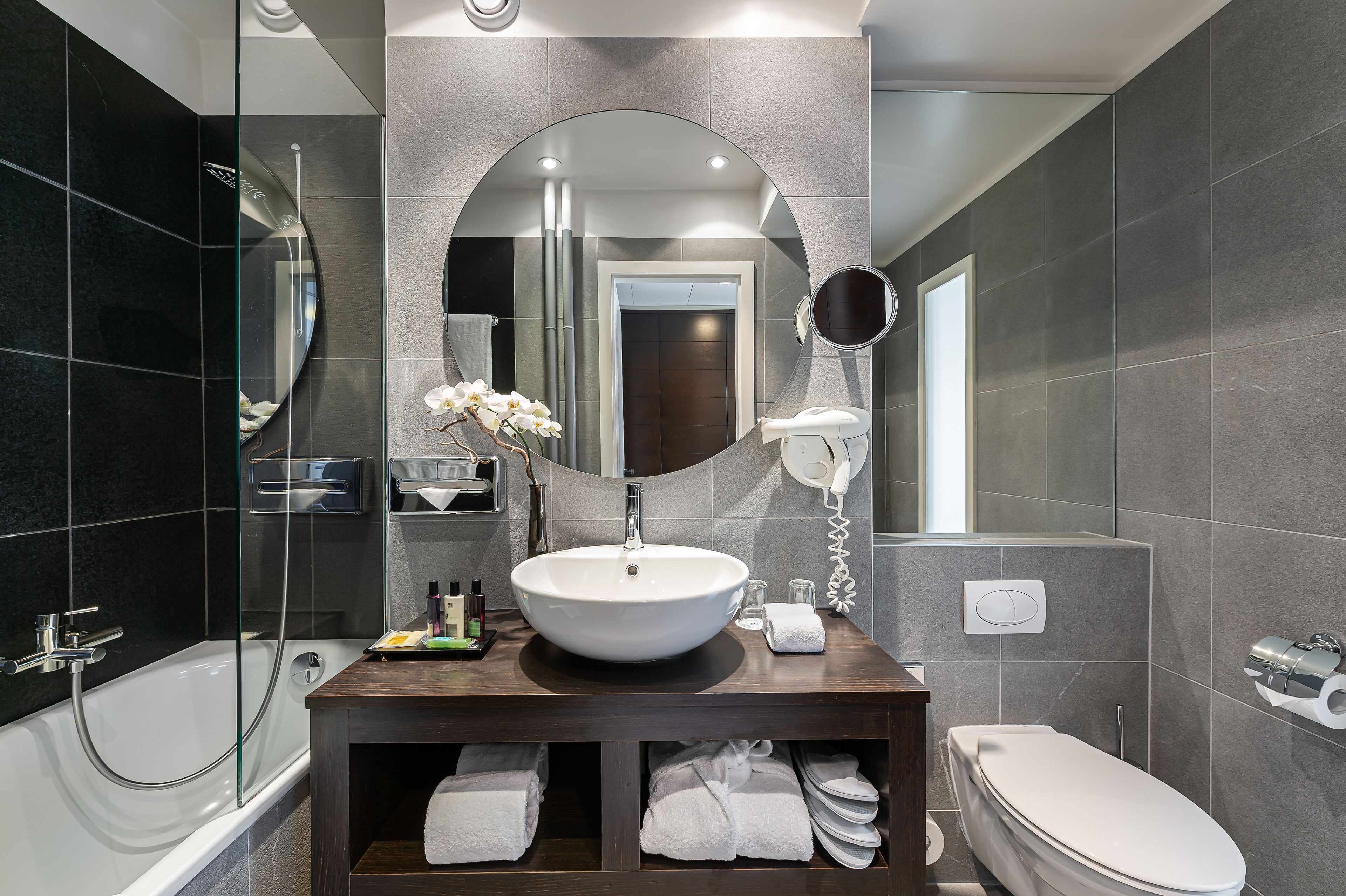 bathtub, free toiletries, hair dryer, slippers