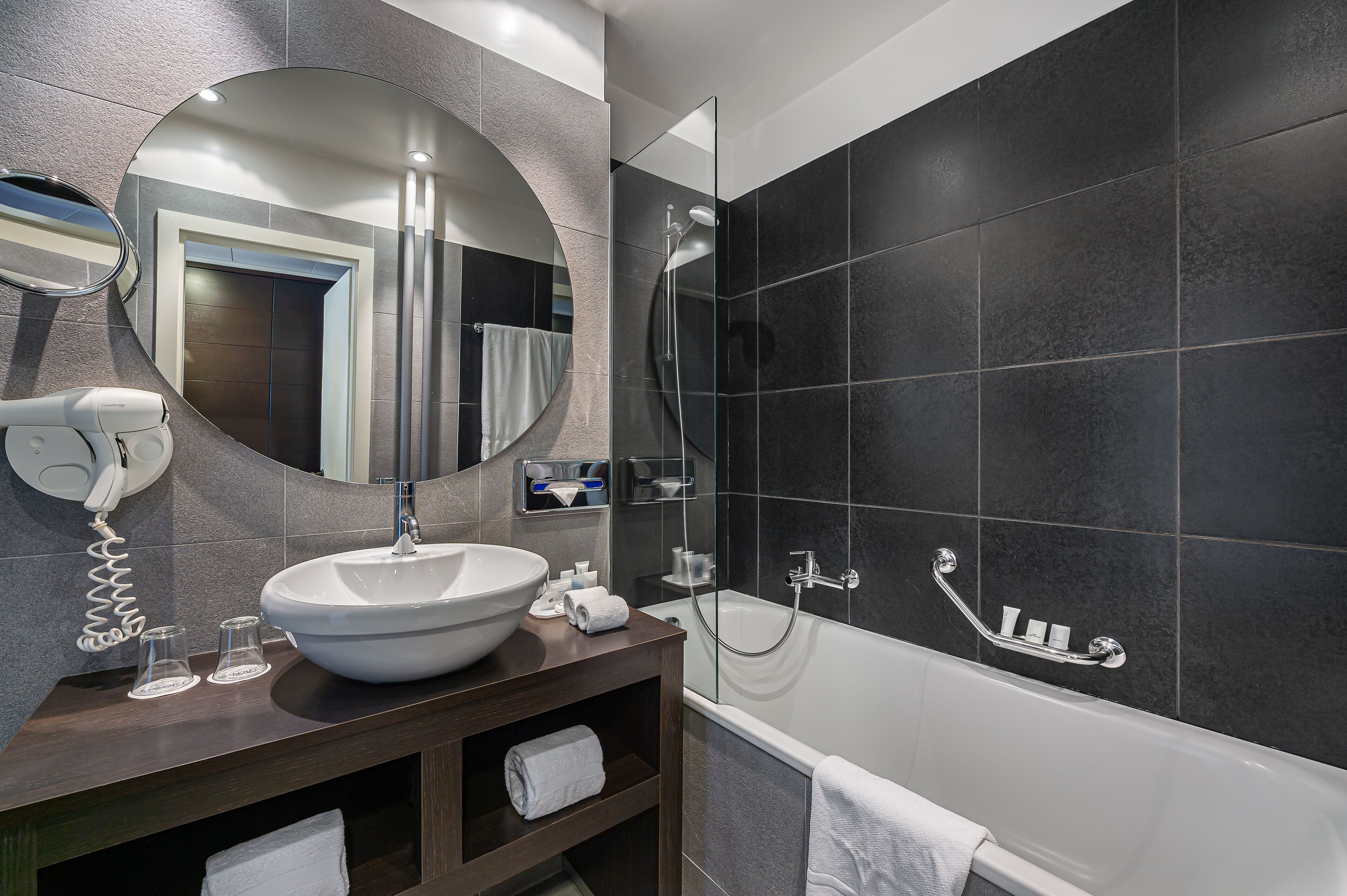 bathtub, free toiletries, hair dryer, slippers