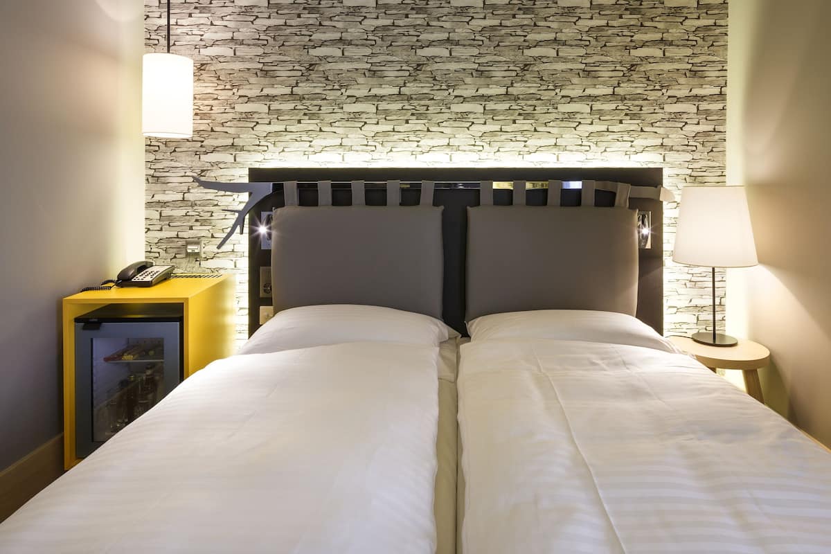 Premium bedding, down duvets, minibar, in-room safe