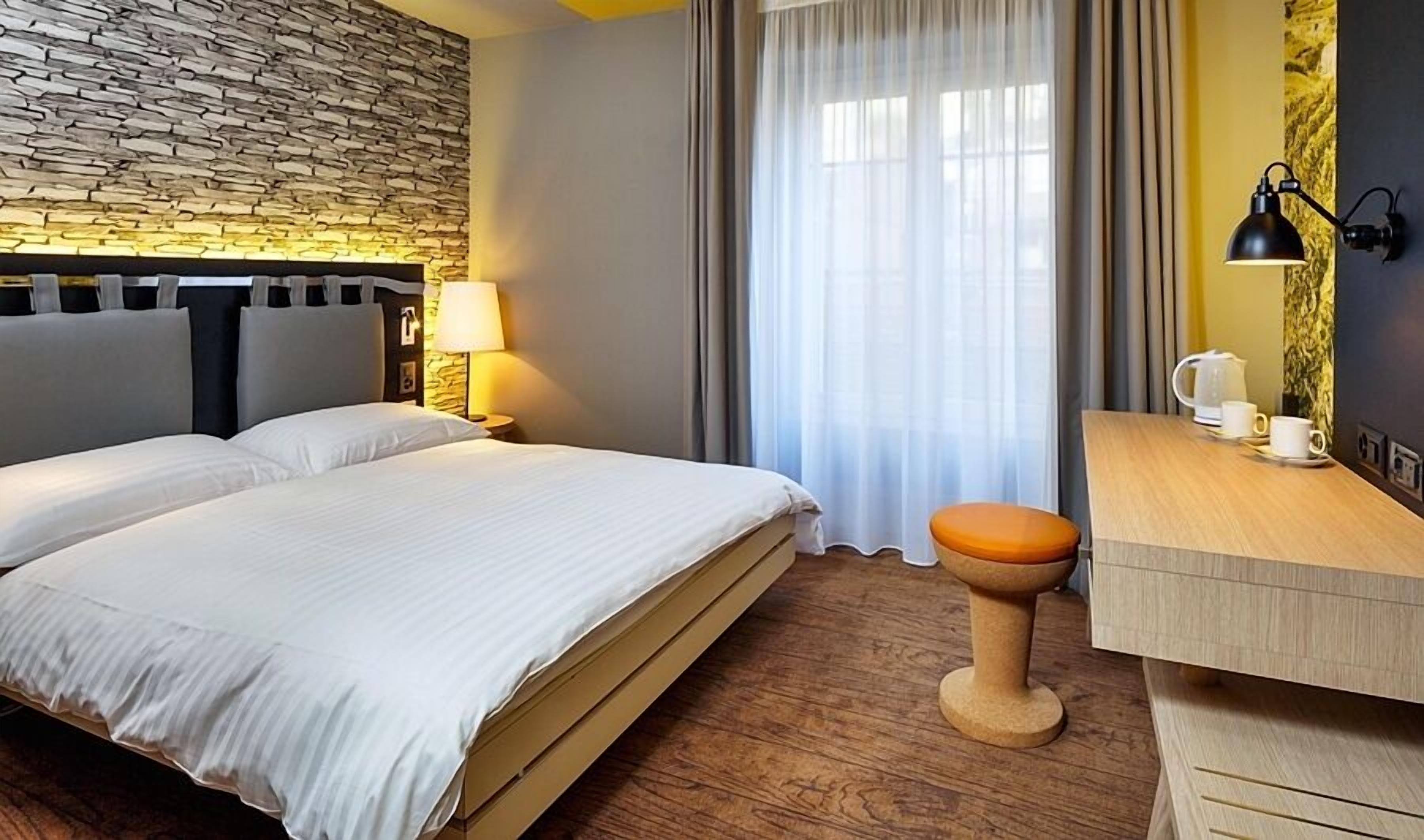 Premium bedding, down comforters, minibar, in-room safe