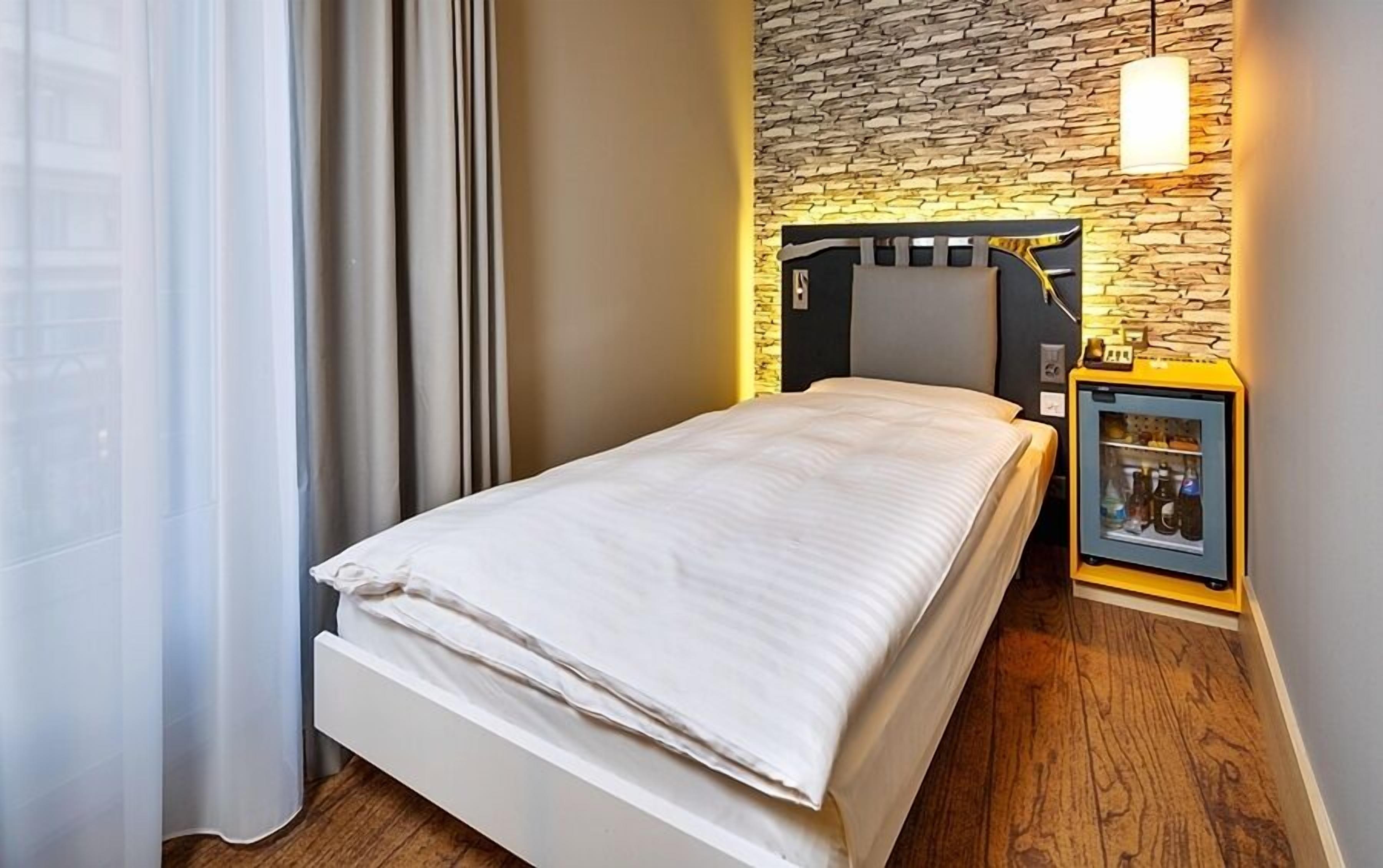 Premium bedding, down comforters, minibar, in-room safe